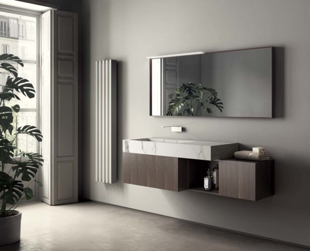 Mobile sospeso con finitura rovere termocotto e piano lavabo in gres statuario opaco
